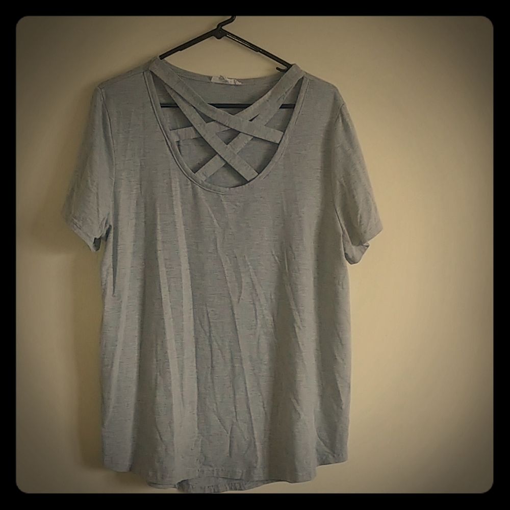 Gray tee-shirt with straps across the chest.